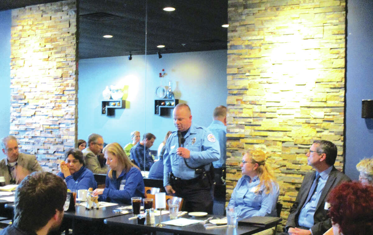 Edwardsville Police Officer Andy Feller speaks at the township's Lunch and Learn event.