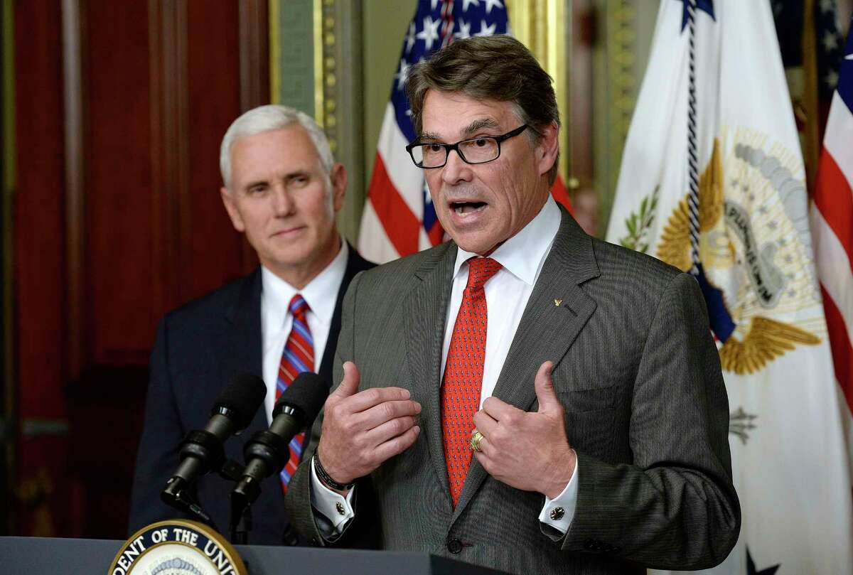 Accompanied by Vice President Mike Pence, Rick Perry speaks after being sworn in as secretary of energy. On Friday, he addressed the department's employees.