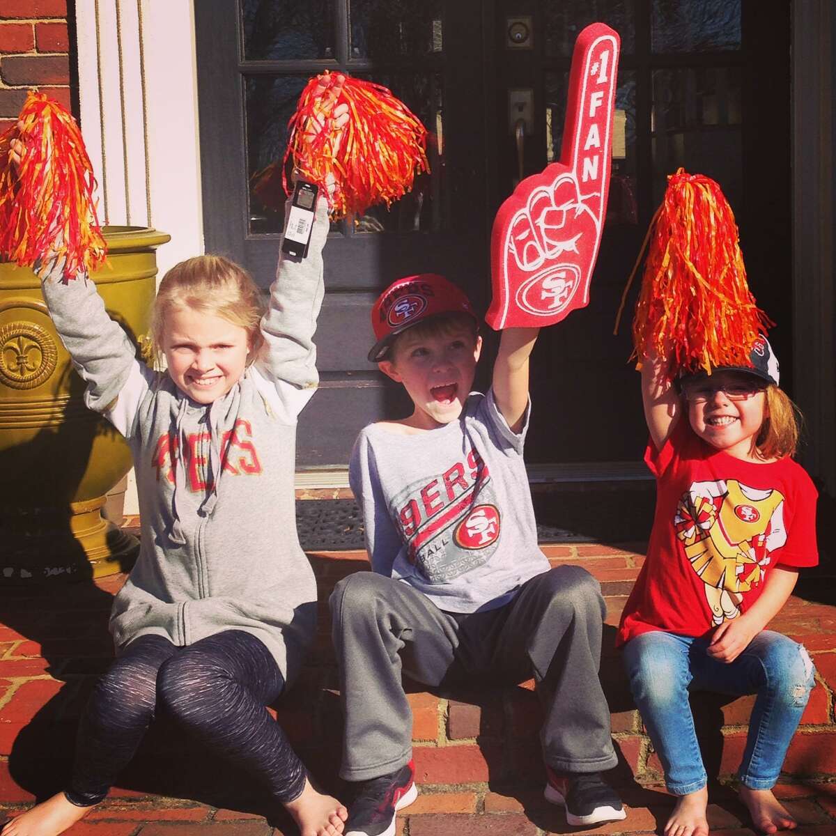 Kyle Shanahan's children (from left) Stella age 9, Carter age 7 and Lexi age 4 celebrate their father's new position as Head Coach of the San Francisco 49ers.