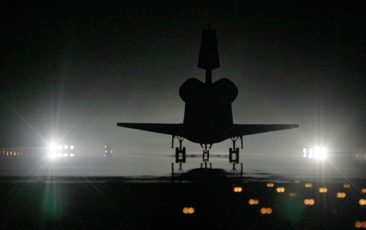 The space shuttle Atlantis lands after completing the final mission of the space shuttle program Thursday, July 21, 2011, in Kennedy Space Center.