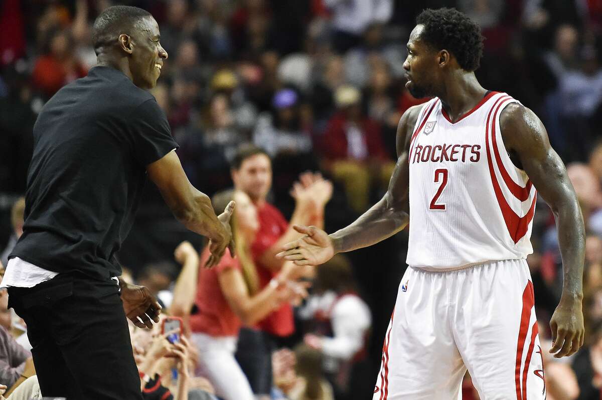 Houston Rockets guard Patrick Beverley (2) celebrates a 3-pointer by guard James Harden with ex-Houston Rockets player Vernon Maxwell, during the second half of an NBA basketball game against the Memphis Grizzlies, Saturday, March 4, 2017, in Houston. Houston won 123-108. (AP Photo/Eric Christian Smith)