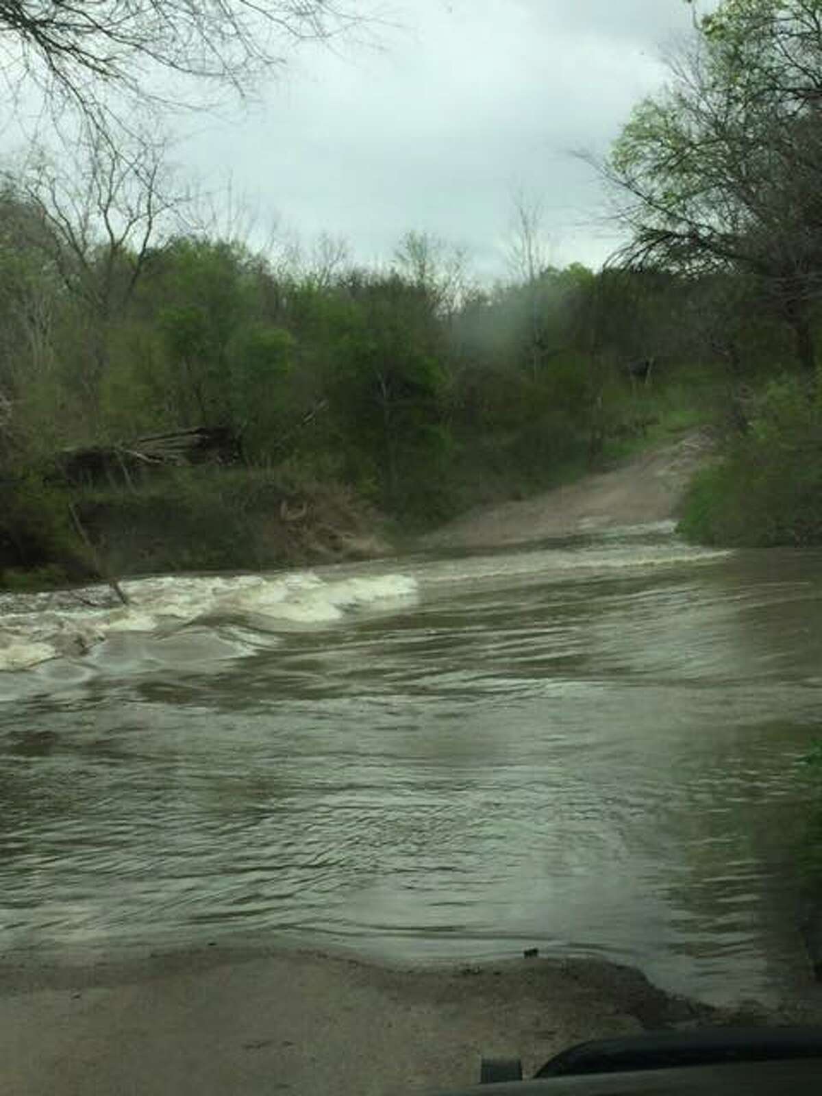 New Berlin Volunteer Fire Department rescued a woman from Cibolo Creek Sunday afternoon, March 5, 2017. Pictured is the road the driver attempted to cross. 