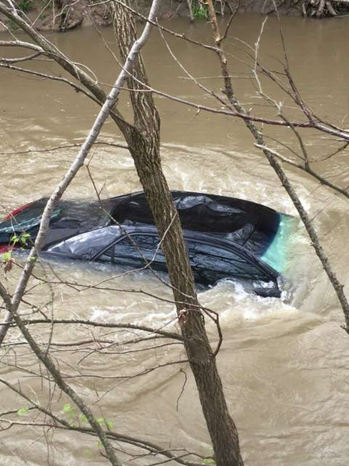New Berlin Volunteer Fire Department rescued a woman from Cibolo Creek Sunday afternoon, March 5, 2017. A Texas Parks & Wildlife Department Facebook post reported the vehicle and woman floated 500 yards down Cibolo Creek after being swept off the road.