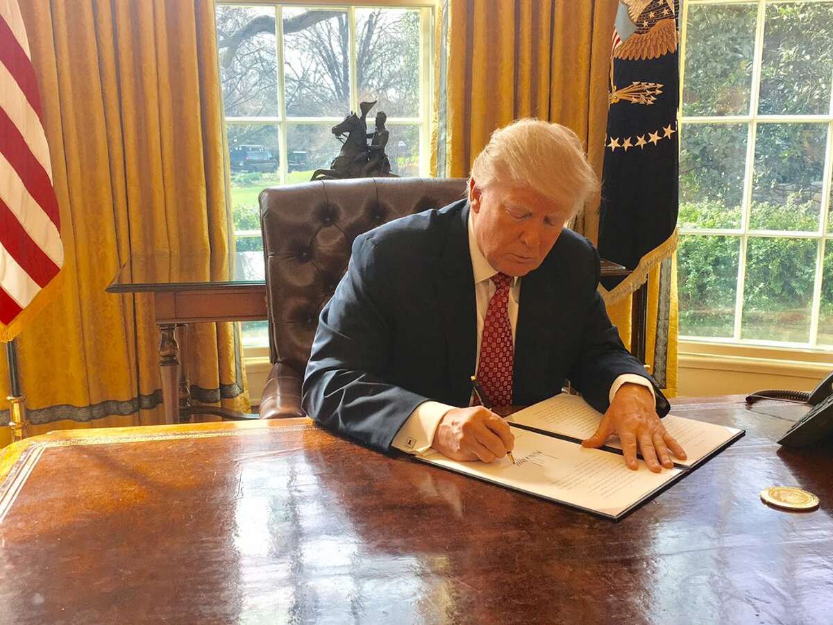 President Donald Trump on Monday signs a new version of his controversial travel ban, aiming to withstand court challenges while still barring new visas for citizens from six Muslim-majority countries and shutting down the U.S. refugee program.