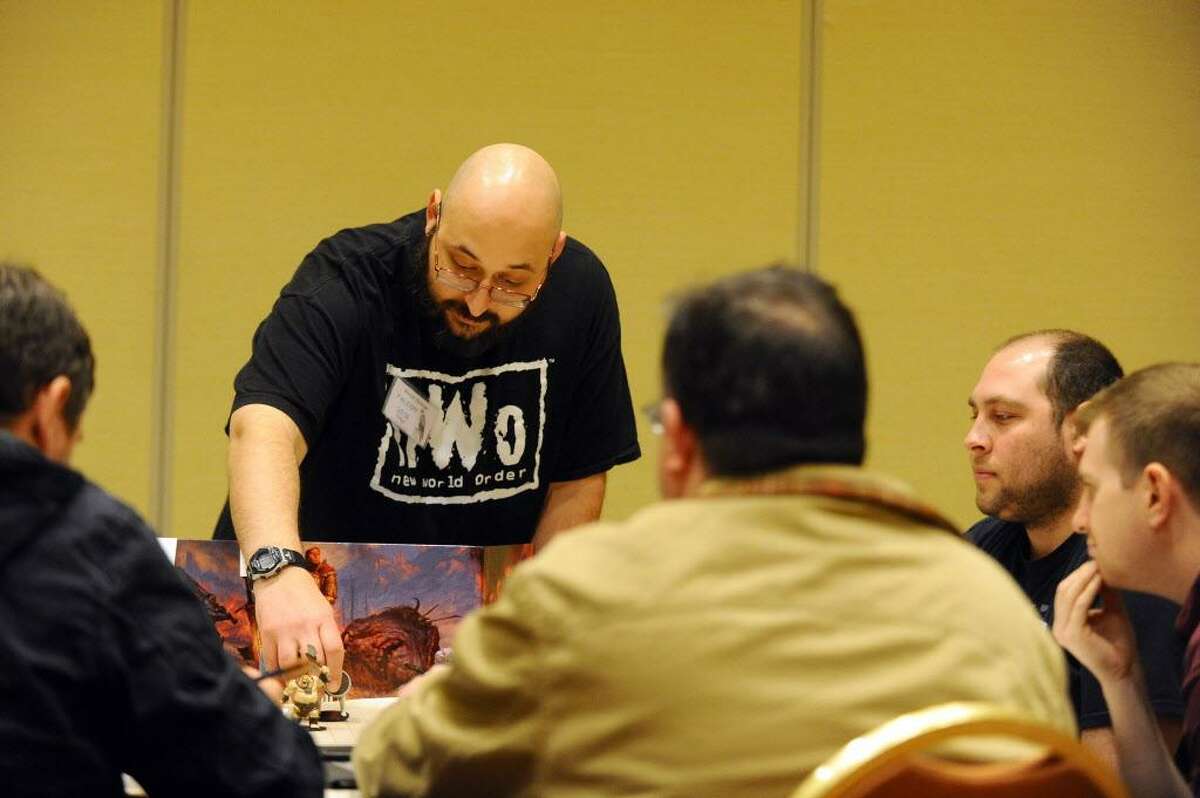Walter Streigle leads the role playing game Storm King's Thunder during the third day of ConnCon Falcon 2016, a fantasy board, card and role playing game conference inside the Stamford Marriott hotel in Stamford, Conn. on Sunday, Oct. 30, 2016.