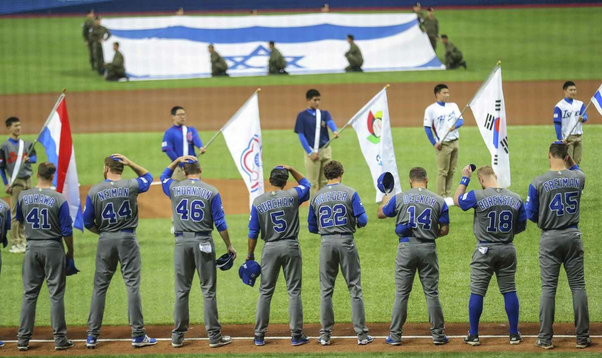 Members of Team Israel remove their caps for the national anthem during the opening ceremony of the World Baseball Classic at Gocheok Sky Dome in Seoul, South Korea, March 6, 2017.