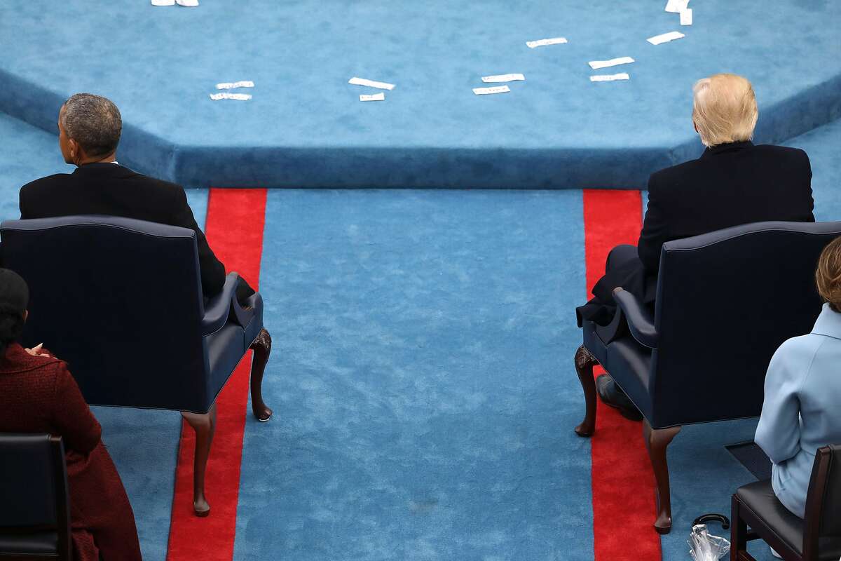 FILE -- President Barack Obama sits across from Donald Trump at his inauguration in Washington, Jan. 20, 2017. Without offering any evidence or providing the source of his information, Trump alleged that Obama had tapped his phones in the months before the presidential election, in a series of tweets sent on March 4. (Damon Winter/The New York Times)