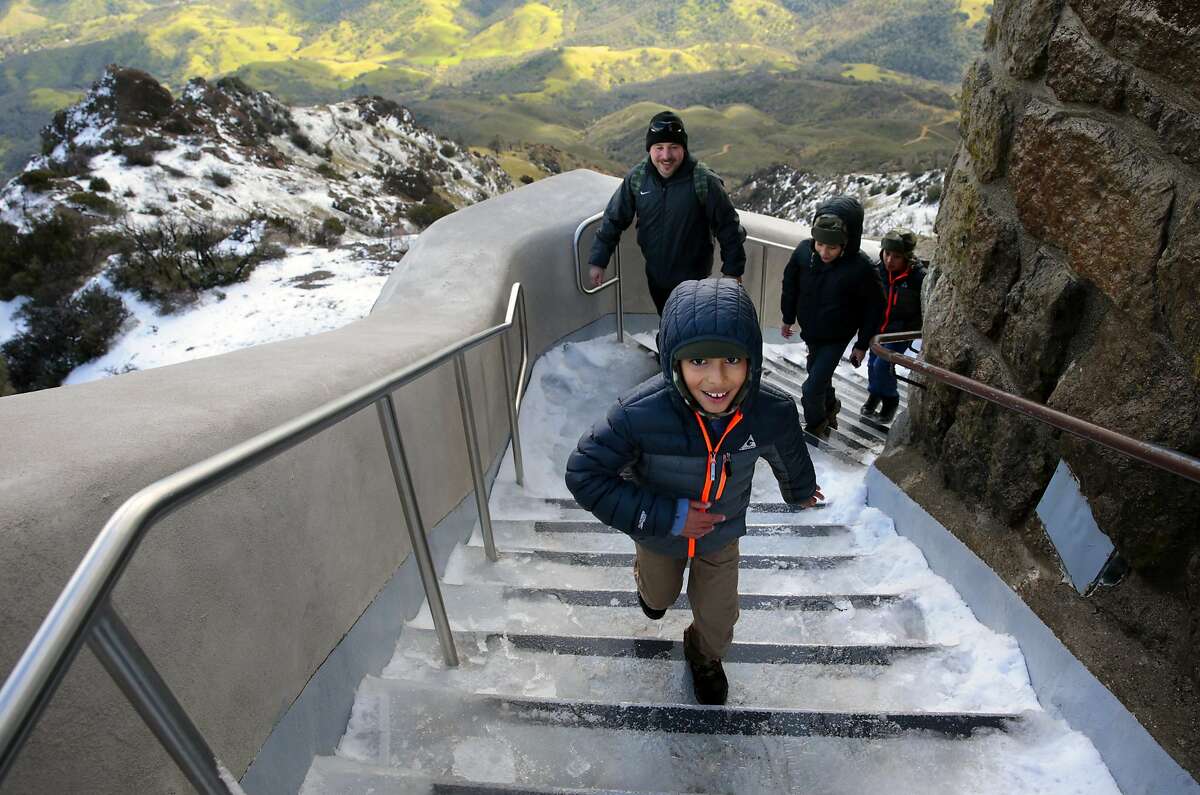 The Del Valle family of Concord (front to back) Brandon, 8 Israel, Alex,12 and Matthew,10 reach the summit's observation deck on Mt. Diablo State Park which received a couple of inches of snow during the latest storm to move across the Bay Area as seen on Mon. March 6, 2017, near Danville, Ca.