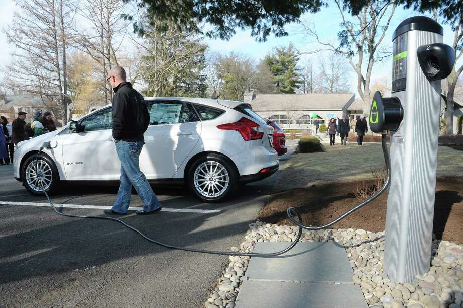 State Plans 450 New Electric Car Charging Stations Times Union A Ford Focus Electric Car From Metro Of Albany Is Plugged Into Charging Station