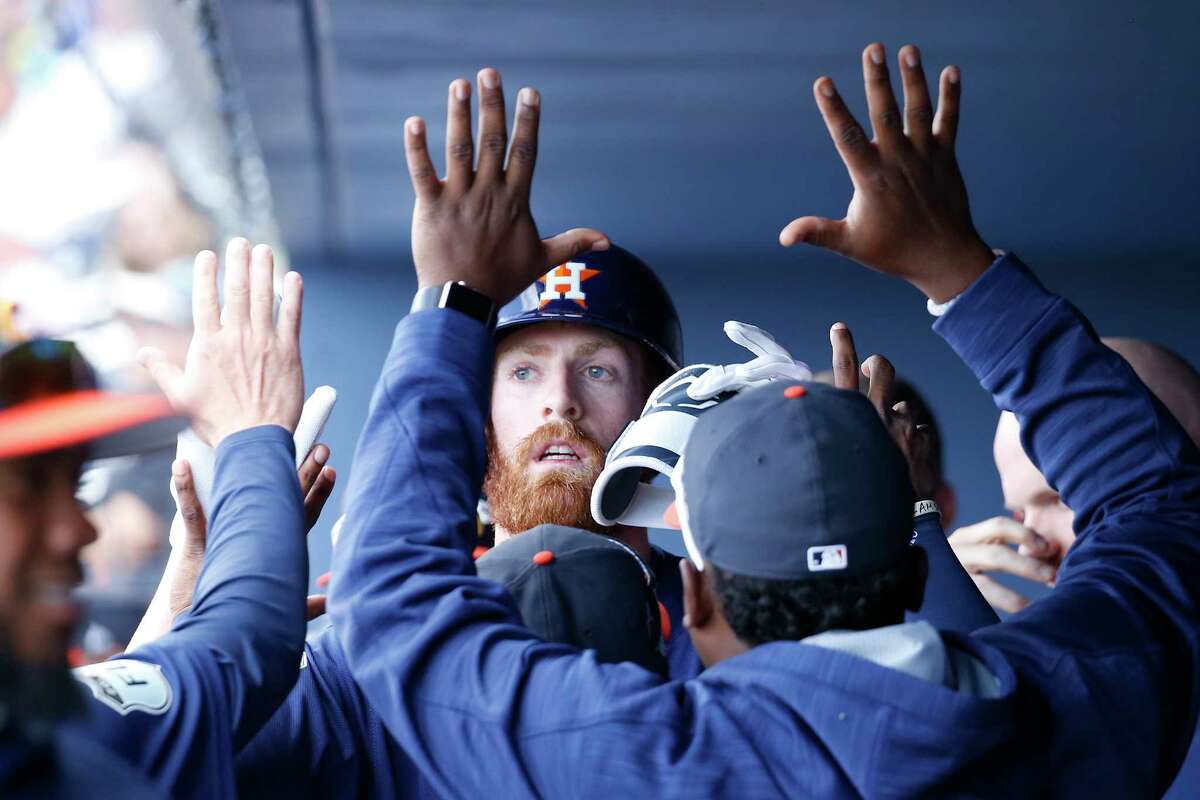 WEST PALM BEACH, FL - MARCH 6: Colin Moran #19 of the Houston Astros is congratulated after hitting a home run to tie the game against the Boston Red Sox in the eighth inning during a spring training game at The Ballpark of the Palm Beaches on March 6, 2017 in West Palm Beach, Florida. The Astros and Red Sox played to a 5-5 tie. (Photo by Joel Auerbach/Getty Images)