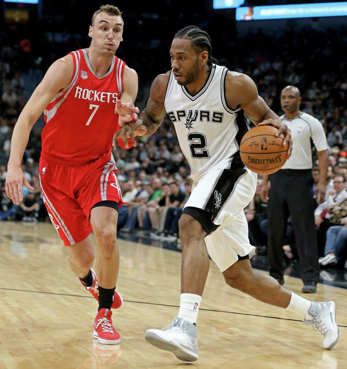 San Antonio Spurs' Kawhi Leonard drives around Houston Rockets?• Sam Dekker during first half action Monday March 6, 2017 at the AT&T Center.