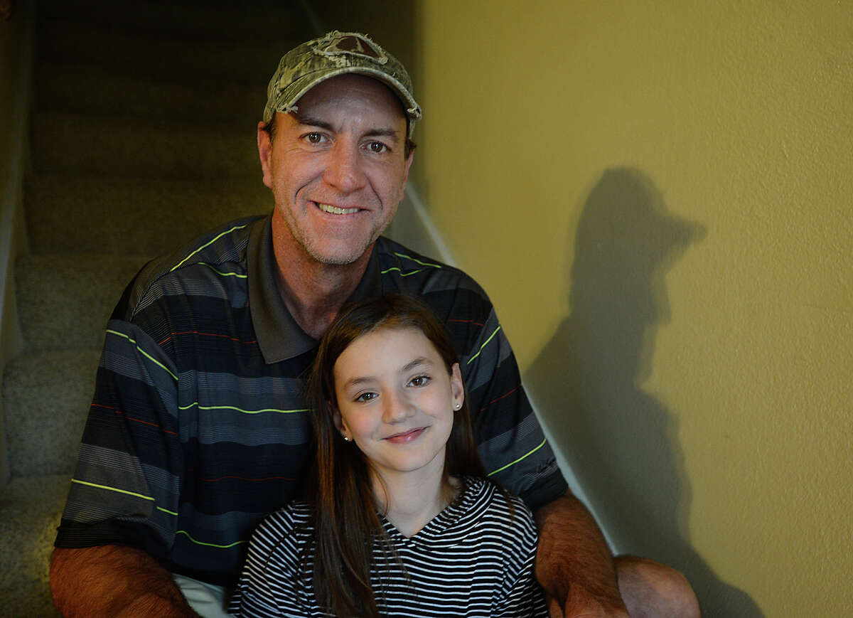 Twelve-year-old Sadie has heard choruses of the phrase "you have the coolest Dad" from classmates and teachers alike this week after a video showing she and father Ray Mason dancing at the Caldwood Elementary School father-daughter dance went viral. The pair were caught on camera as they danced to Bruno Mars' "24K Magic," and Mason says he was inundated with calls the next day from friends who saw the post on Facebook and noticed the over 3 million views it had gotten. Photo taken Monday, March 6, 2017 Kim Brent/The Enterprise