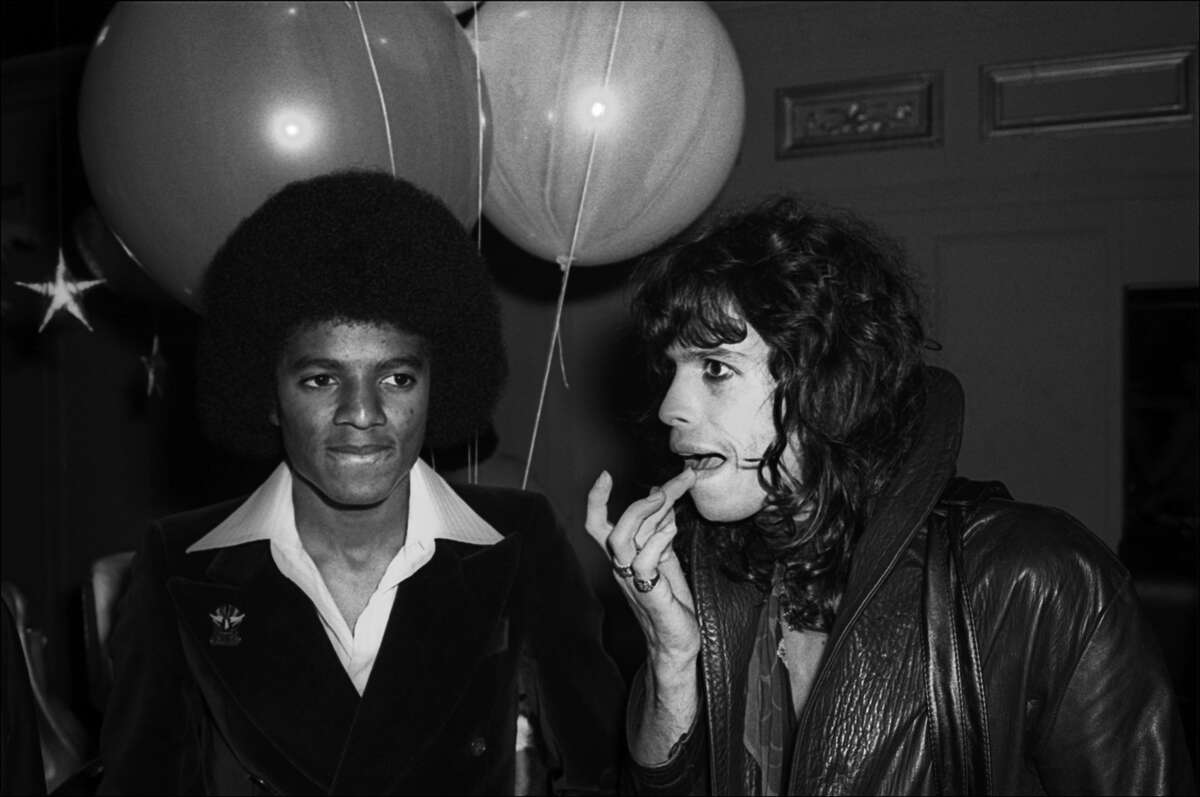 American musicians Michael Jackson, of the Jackson 5, and Steve Tyler, of the group Aerosmith, attend a Beatlemania party at Studio 54, New York, New York, June 9, 1977.