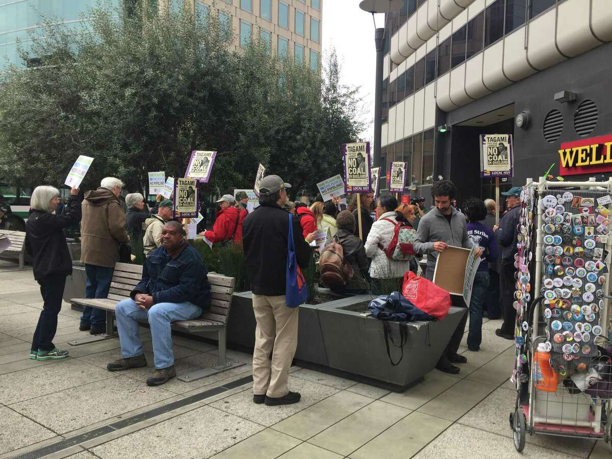 Small group of “Resist Trump” demonstrators gather in front of the Wells Fargo bank at 12th Street and Broadway in downtown Oakland to protest the Dakota Access pipeline that the president gave the go-ahead to begin construction last month.