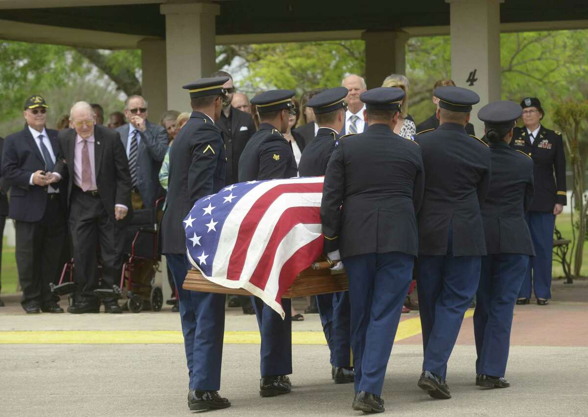 The casket bearing the body of Col. Robert B. Tully arrives for burial ceremony at Fort Sam Houston National Cemetery.