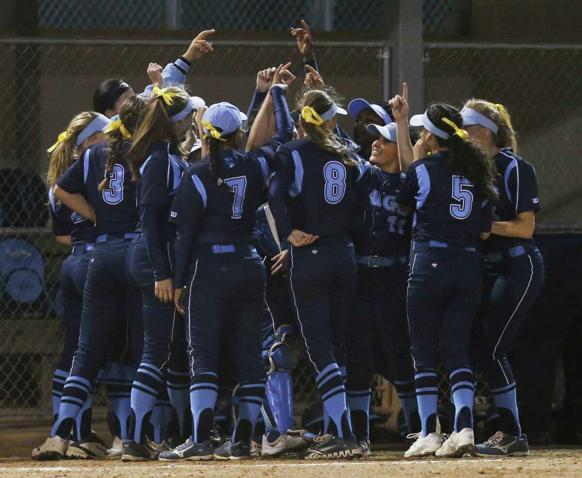 The Johnson softball team gathers before their game against MacArthur in girls softball at NEISD Complex's West Field on Tuesday, Mar. 7, 2017. Johnson is No. 1 and MacArthur is No. 2 in Express-News Area rankings. (Kin Man Hui/San Antonio Express-News)