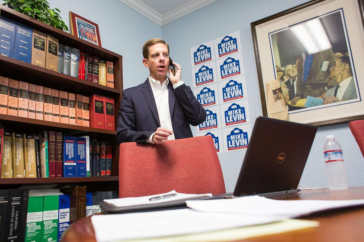 Democratic United States Congressional candidate Mike Levin talks with a reporter during a day of fundraising at the Law Office of Frank P. Barbaro on Tuesday, March 7, 2017 in Santa Ana, Calif. Levin drummed up support before announcing his candidacy for California's 49th congressional district Wednesday.