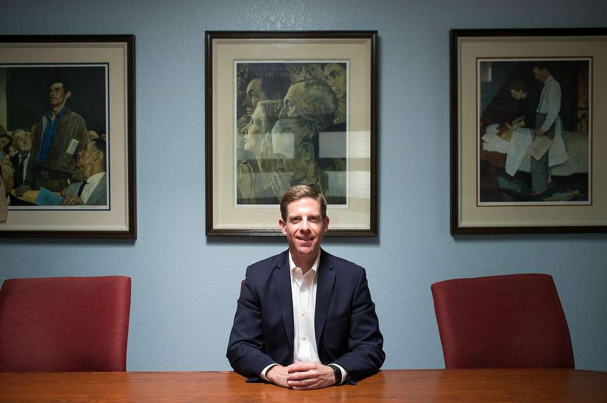 Democratic United States Congressional candidate Mike Levin poses for a portrait in front of reproductions of Norman Rockwell's "Four Freedoms" during a day of fundraising at the Law Office of Frank P. Barbaro on Tuesday, March 7, 2017 in Santa Ana, Calif. Levin drummed up support before announcing his candidacy for California's 49th congressional district Wednesday.