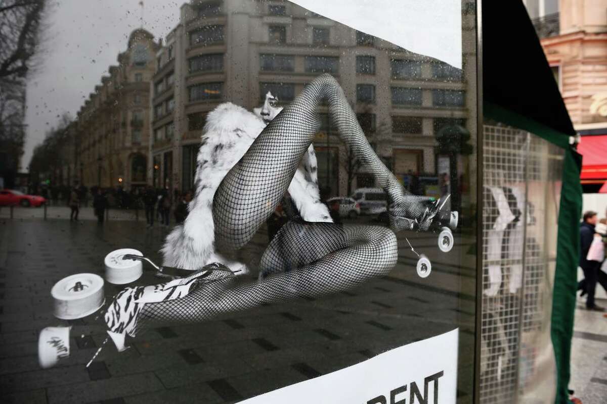 YSL ad with model in fur, fishnets triggers sexism outcry