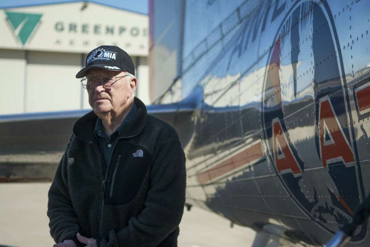 In a March 2, 2017 photo, WWII veteran, former POW and Denton, Texas resident Leroy Williamson stands next to the Flagship Detroit, a restored DC-3 airliner built in 1937, in Denton, Texas. Williamson, 96, flew over the city, reliving his experience resupplying West Berlin after the war.