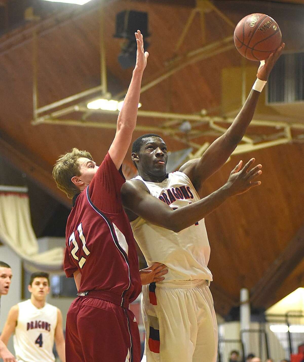 GFA’s Sunday Okeke, right, puts up a shot over St. Luke’s Jackson Selvala during the first half of Sunday’s NEPSAC Class C Championship game at Clark University in Worcester, Mass. St. Luke’s defeated GFA 74-65.