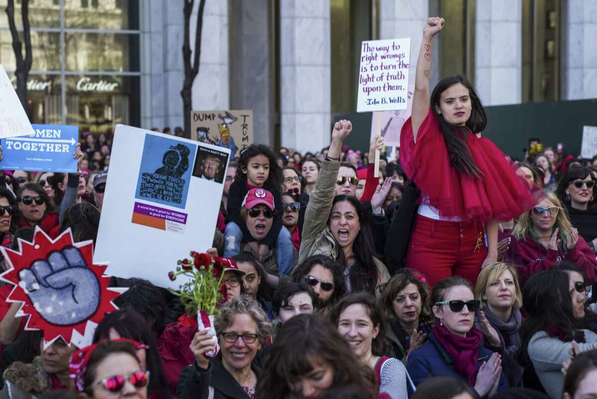 Demonstrators gather at the corner of 59th Street and Fifth Avenue in New York as part of the A Day Without a Woman protest Wednesday.