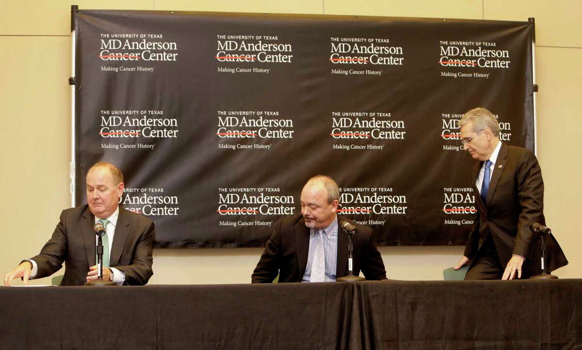 Dr. Tom Buchholz, left, executive vice president and physician-in-chief, Dan Fontaine, center, executive vice president of administration and chief financial officer, and Dr. Ronald DePinho, right, president of The University of Texas MD Anderson Cancer Center, are shown leaving a news conference at the MD Anderson South Campus Research II Building, 7435 Fannin, about a reduction in the institution's workforce Thursday, Jan. 5, 2017, in Houston.