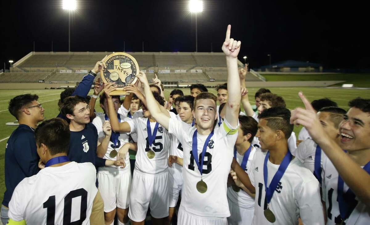 Central Catholic players celebrate with their TAPPS Division I state championship soccer trophy at Waco ISD Stadium on March 8, 2017 in Waco.