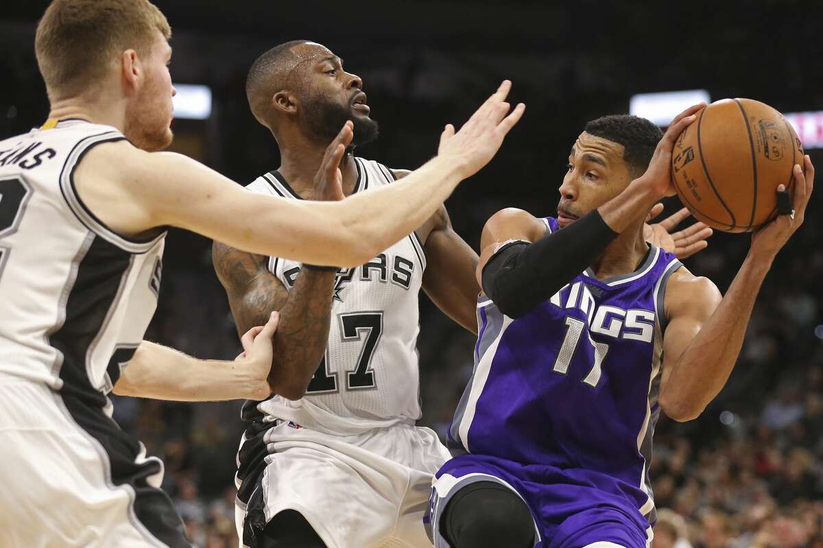 San Antonio Spurs?’ Davis Bertans and Jonathon Simmons put pressure on Sacramento Kings?’ Garrett Temple during the second half at the AT&T Center, Wednesday, March 8, 2017. The Spurs won 114-104.