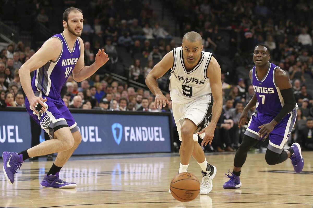Spurs’ Tony Parker charges into the lane aginst Sacramento on March 8.
