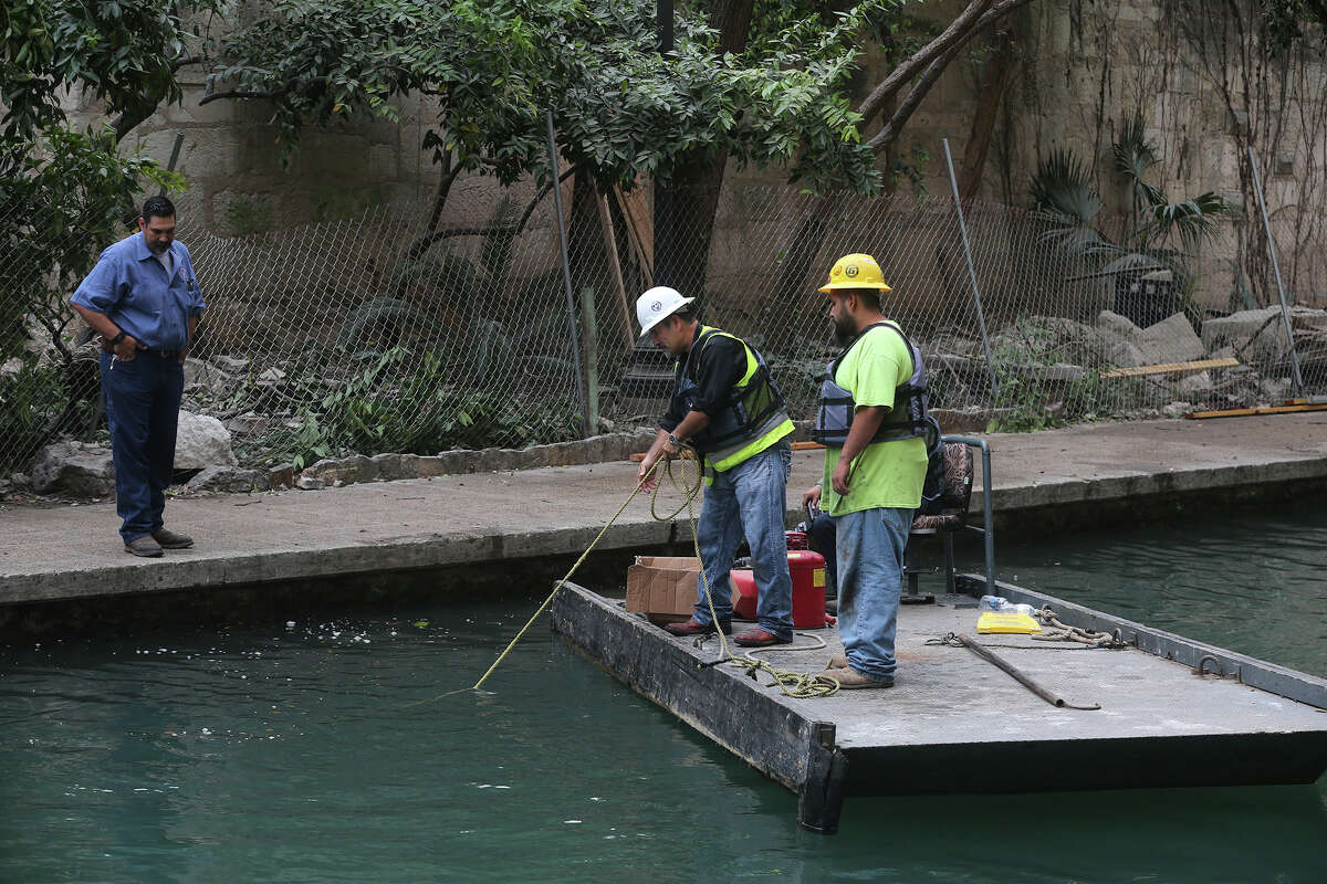 Clean up continues Thursday March 9, 2017 on the San Antonio River after debris fell into it after demolition was taking place yesterday at the former Solo Serve at 114 Soledad Street. Nobody was injured after the accident.