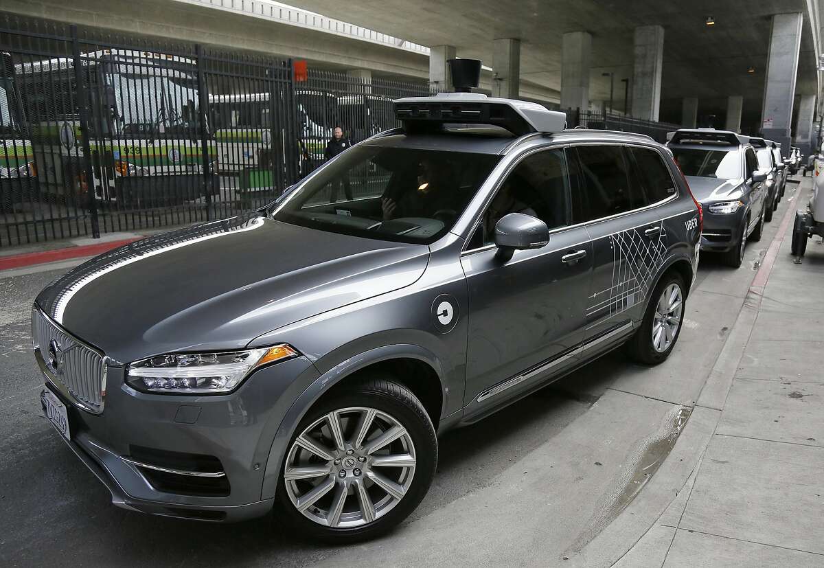 In this file photo, an Uber driverless car heads out for a test drive in San Francisco. Uber's self-driving cars are coming back to California, though the company doesn't plan to pick up passengers for now. The California Department of Motor Vehicles said Wednesday, March 8, 2017, it has granted the ride-hailing company permission to run two Volvo SUVs on public roads. (AP Photo/Eric Risberg, File)
