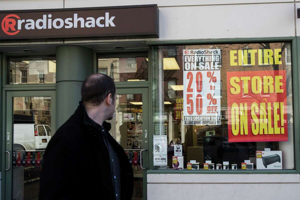 NEW YORK, NY - MARCH 9: A man walks past a RadioShack storefront in the West Village, March 9, 2017 in New York City. RadioShack has filed for bankruptcy for the second time in two years and will close about 200 of its remaining 1,500 stores. (Photo by Drew Angerer/Getty Images)