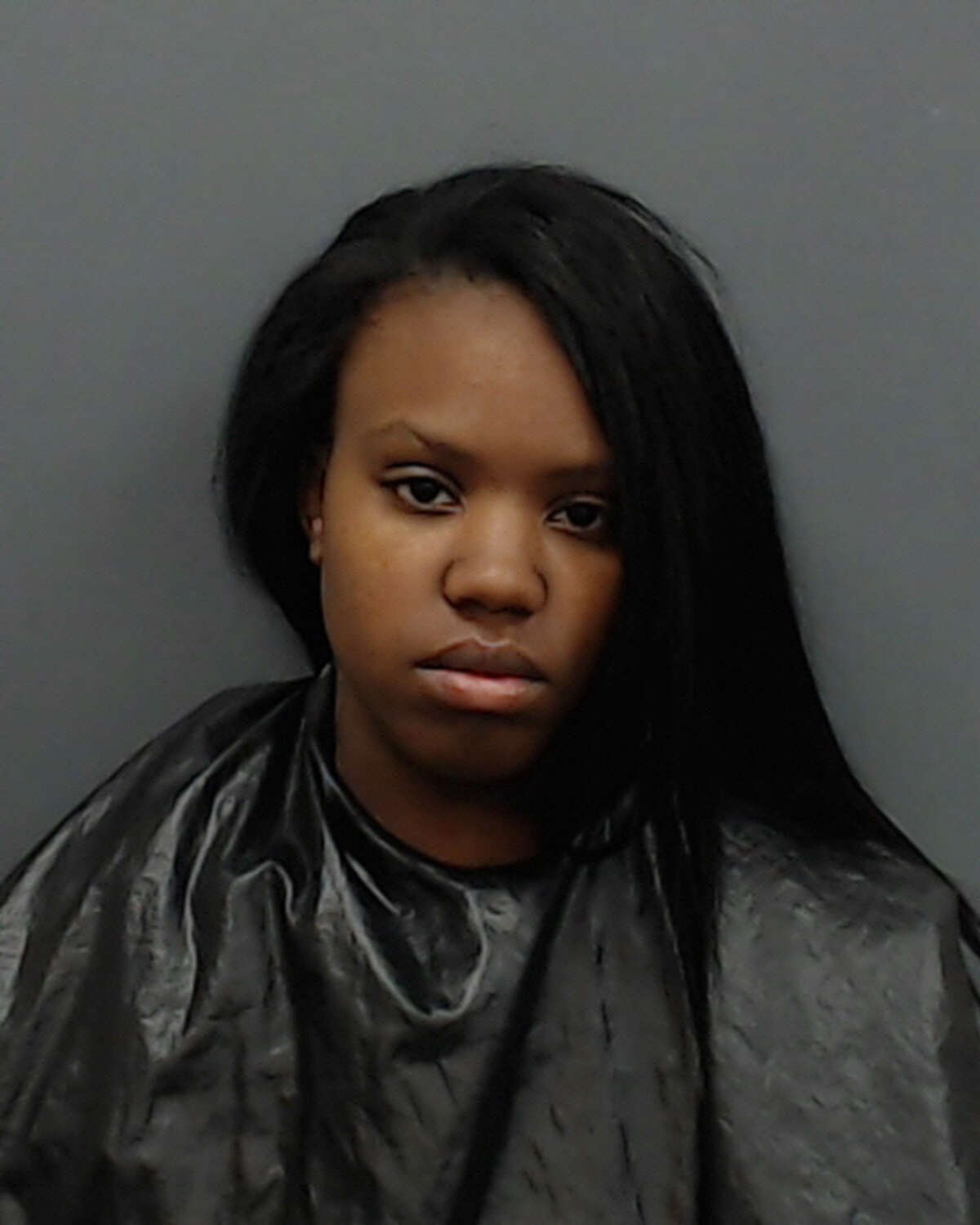 Laneshia Lashae Young, 22, was charged with tampering with or fabricating physical evidence (human corpse), a second-degree felony, and tampering with physical evidence, a third-degree felony.