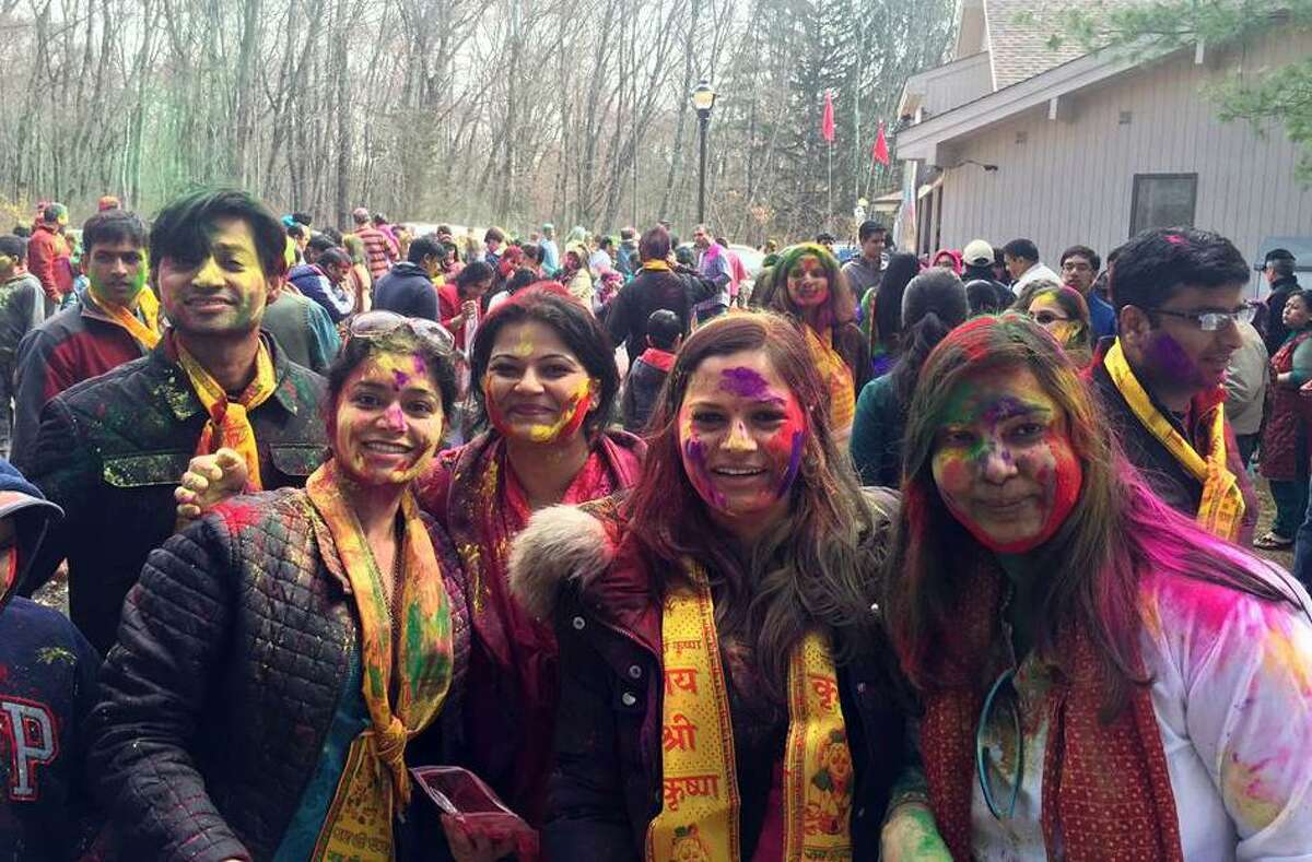 Attendees covered in colorful paint during Holi Festival 2016 at Wilton Hindu Temple, 68 Westport Road.