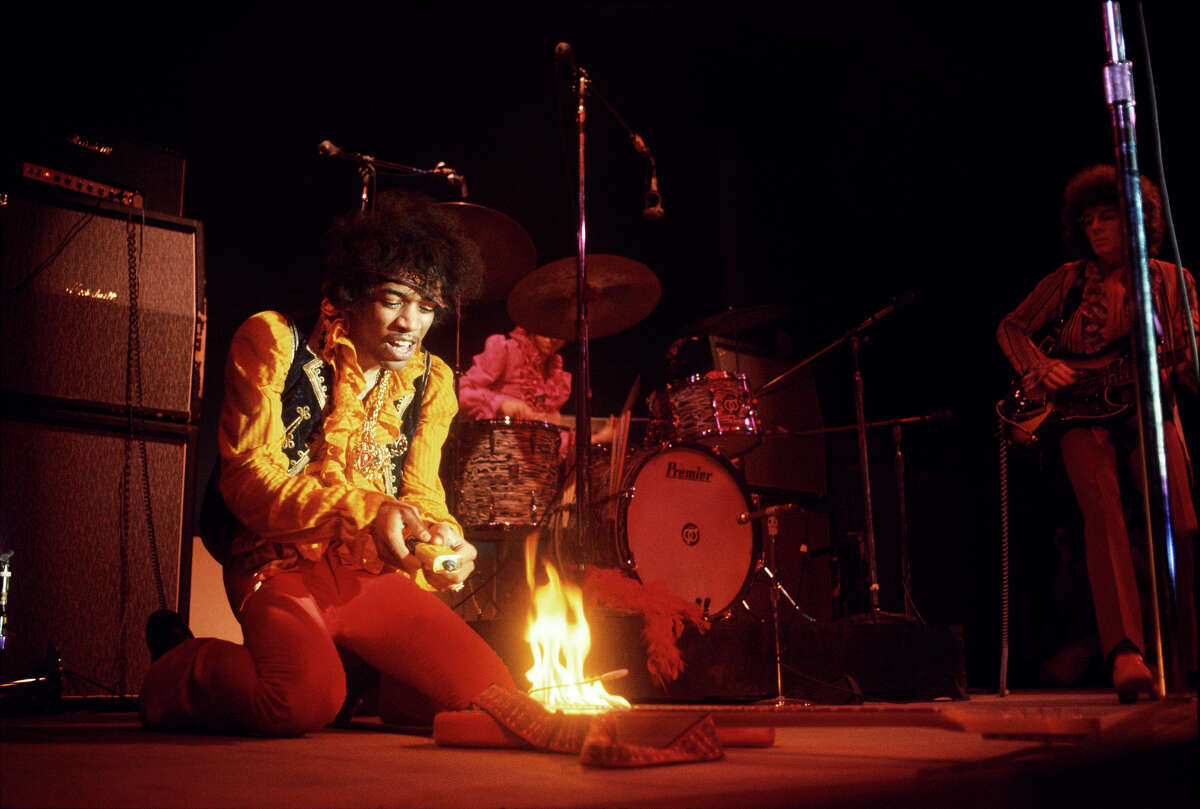 Jimi Hendrix lights his guitar on fire at the Monterey Pop Festival on June 17, 1967.