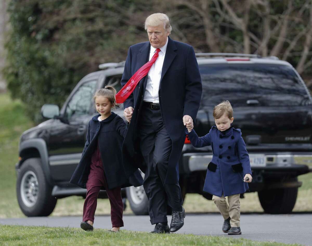 President Donald Trump walks with his grandchildren Arabella Kushner and Joseph Kushner across the South Lawn of the White House. The president continues to generate a heavy volume of letters from both defenders and detractors.