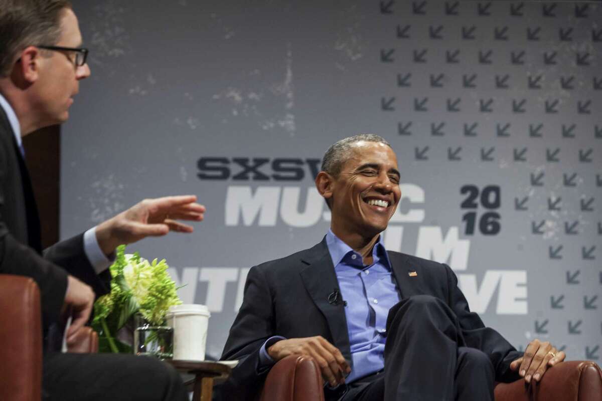 President Barack Obama laughs during a panel discussion with Texas Tribune Editor Evan Smith at the South by Southwest festival in Austin, Texas, March 11, 2016. Former Vice President Joe Biden will speak at the event next week.