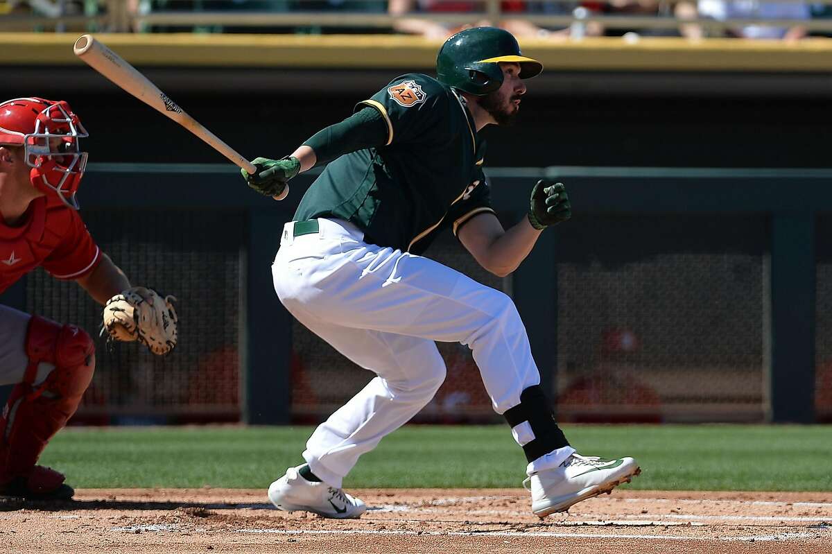 MESA, AZ - MARCH 09: Matt Joyce #23 of the Oakland Athletics singles in the first inning in the spring training game against the Cincinnati Reds at HoHoKam Stadium on March 9, 2017 in Mesa, Arizona. (Photo by Jennifer Stewart/Getty Images)
