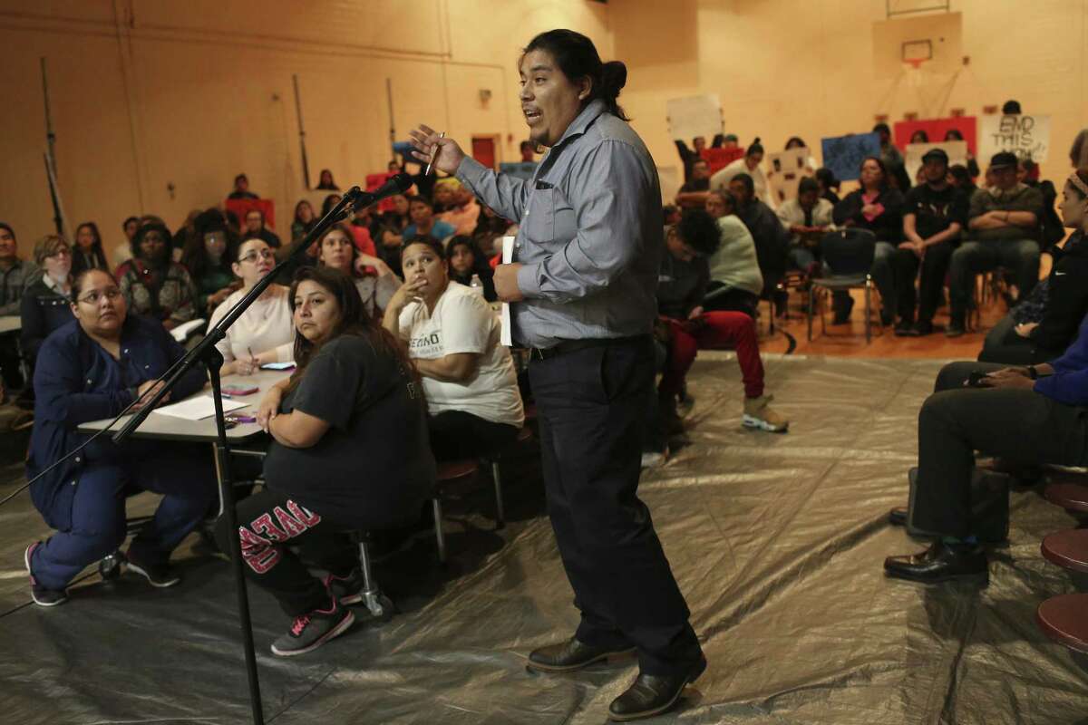 Jhonatan Tello expresses his concerns before two board members of the San Antonio School for Inquiry & Creativity, (SASIC), at their Preparatory Academy campus on Fredericksburg Road, Wednesday, Feb. 15, 2017. Tensions are bubbling over at SASIC, a small charter district beset by an array of complaints of corruption, mismanagement and negligence. Students and parents accuse the district of a range of offenses, including serving spoiled food to students, not providing toilet paper and soap in the bathrooms, and not paying employees, among many others. On Wednesday, parents and community members expressed their grievances at an open forum before board president Denise Fritter and member Nathan Wiegreffe.