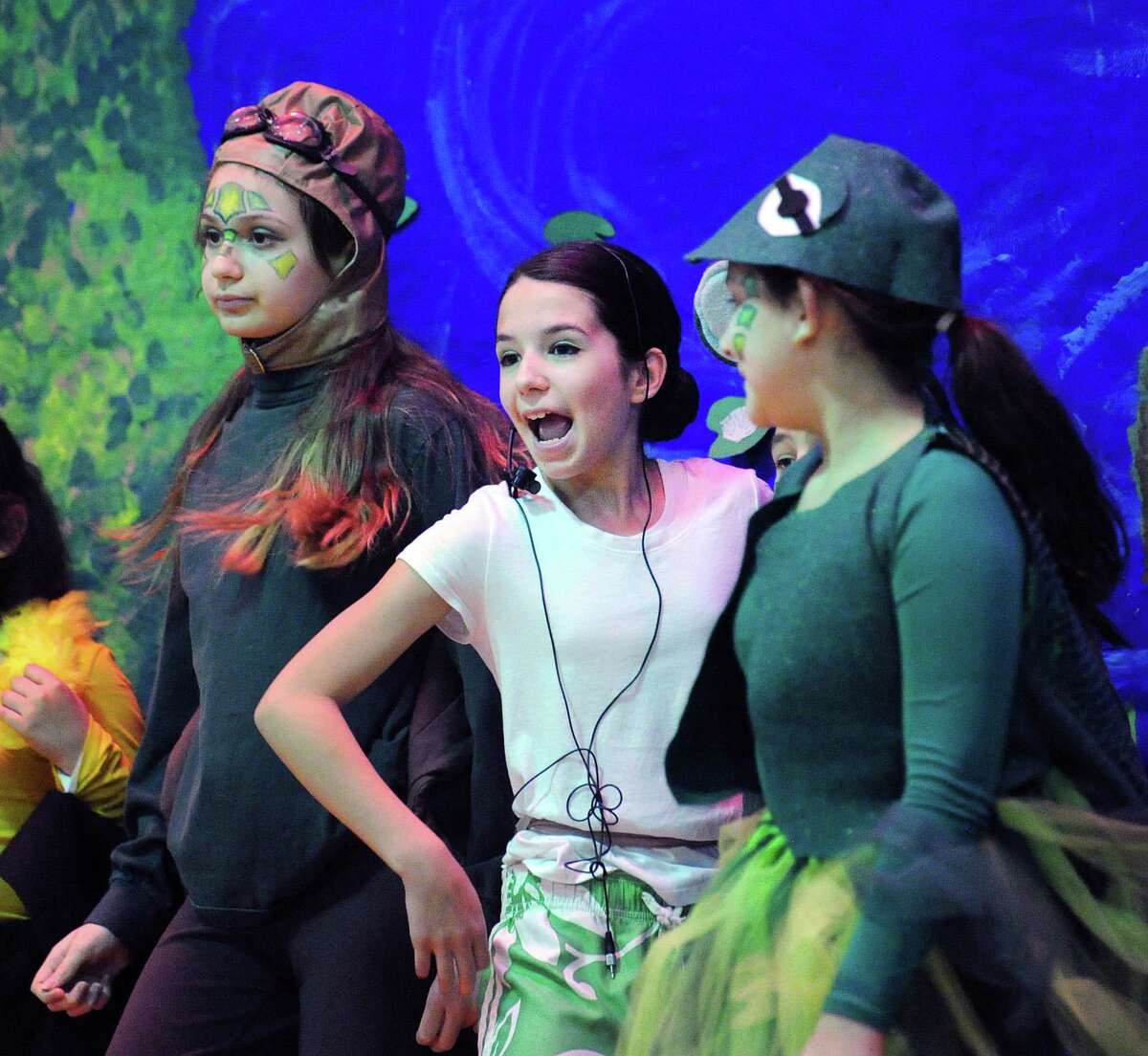 Brenda Galbier, center, played the frog during the New Lebanon School 4th & 5th grade students opening night performance of the play "A Year with Frog & Toad" at the school in Greenwich, Conn., At Thursday, March 9, 2017. Galbier is a 5th grade student at the school. New Lebanon School teacher Carol Pugliano, the director of the production, said about 29 "enthusiastic" students participated in the play that is based on the musical that was written by brothers Robert and Willie Reale and the book was illustrated by Arnold Lobel. The performance took place to a standing-room-only crowd of roughly 100 people in the school's gymnasium.