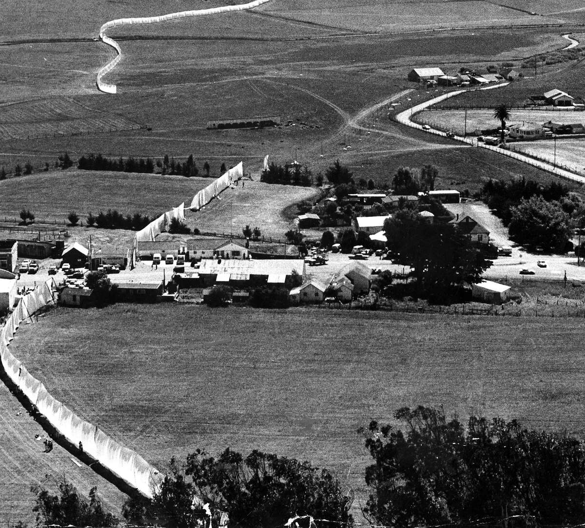 Part of New York artist Christo Javacheff's 24 mile long Running Fence, shown here dropping into the Pacific Ocean September 8, 1976 Photo ran September 9, 1976, P. 1