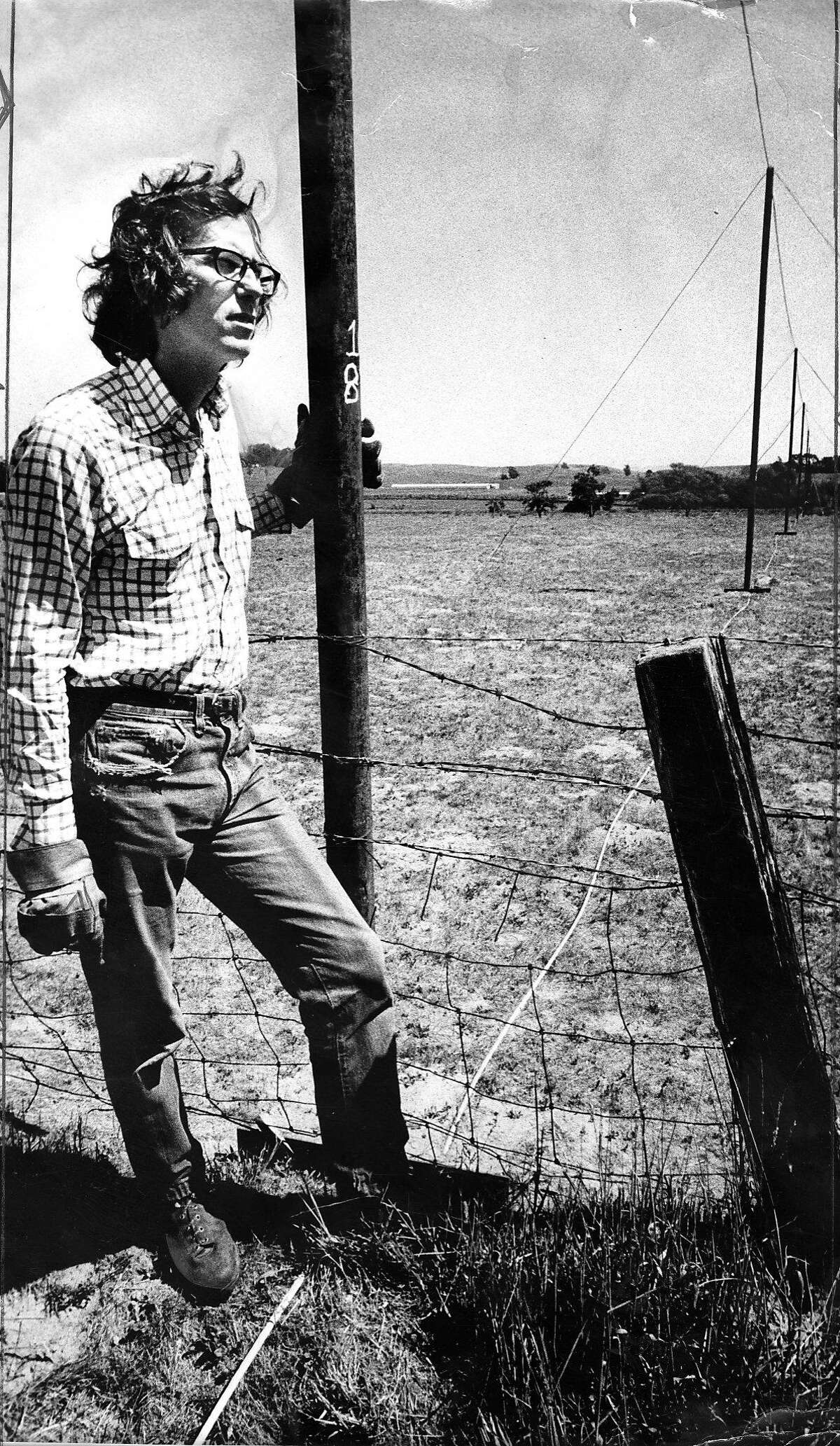 New York artist Christo Javacheff on Valley Ford Road in Sonoma County working on installing his 24 mile long Running Fence, September 1, 1976 Photo ran September 3, 1976, p. 4