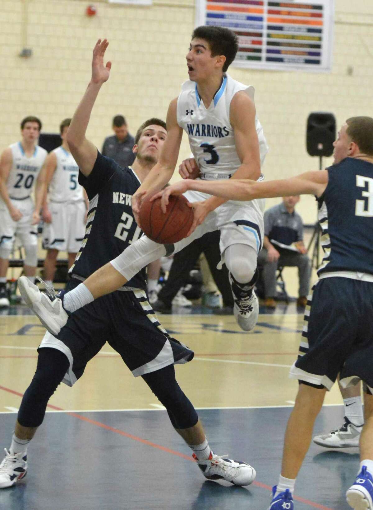 Wilton’s Matt Kronenberg drives to the basket during Class L playoff action vs Newington in Wilton Conn. on Thursday March 9, 2017.