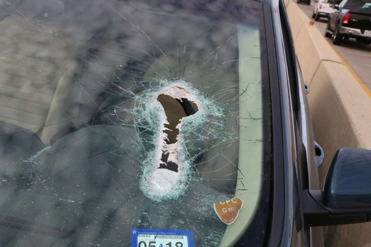 Photos provided by La Porte police show the damage to a vehicle after its driver was struck in the neck by a large flying bolt, March 2, 2017 on Highway 146. Police are looking for information on a large container truck that likely was the source of the flying debris. A $5,000 reward is being offered by Crime Stoppers. 