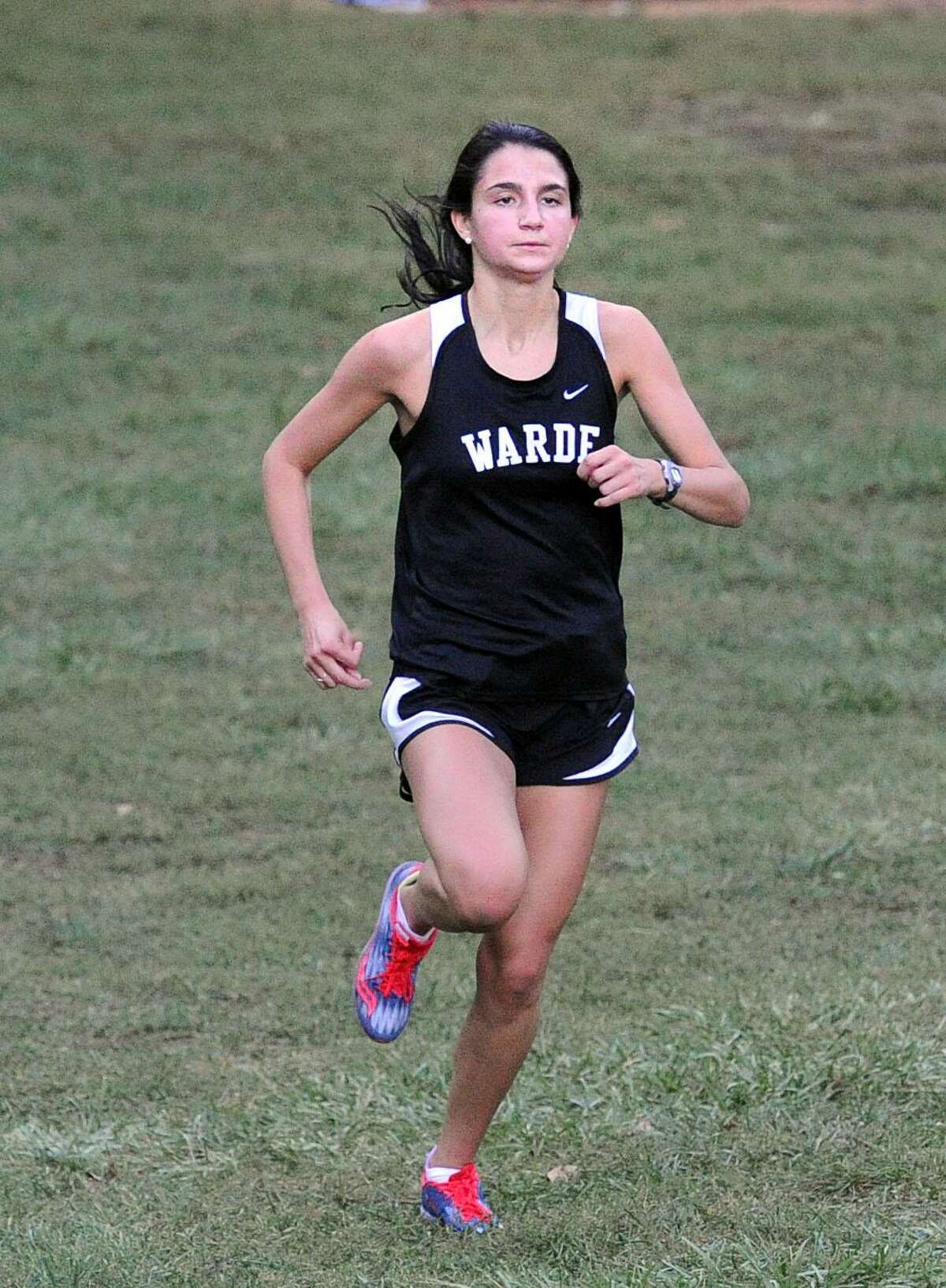 Warde’s Gabi Galletta, shown competing in the FCIAC cross country meet, placed 21st in the 3,200 race at the New England championships and finished second in the Class LL and third in the State Open indoor track 3,200-meter races.