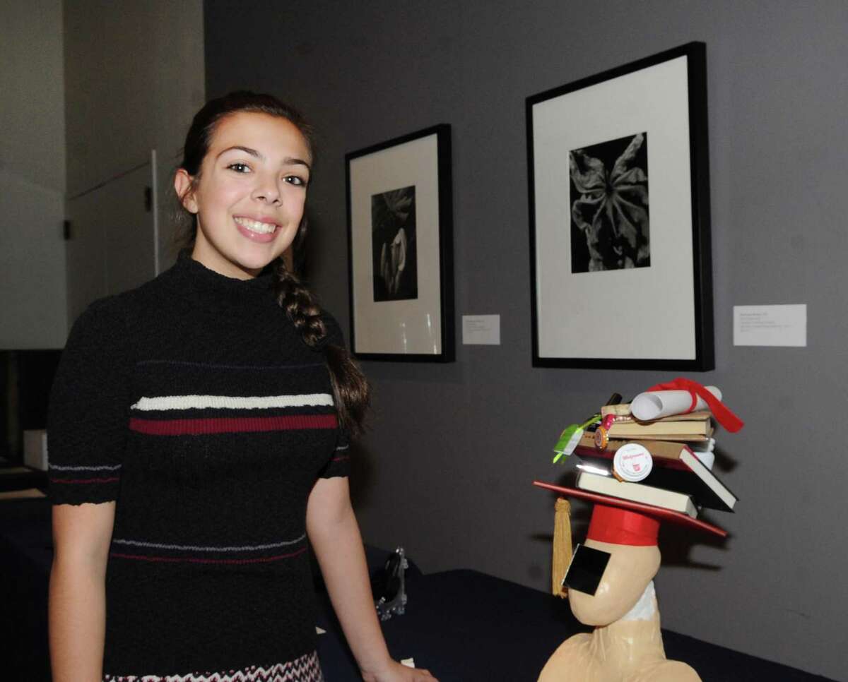 Greenwich High School sophomore, Sophia Fernandez, 15, and her Innovation Lab sculpture titled "Cracked Under Pressure" that she said attempts to bring awareness to the pressures that students have to deal with during the Innovation Lab exhibition at the Bruce Museum in Greenwich, Conn., Wednesday night, Feb. 8, 2017.
