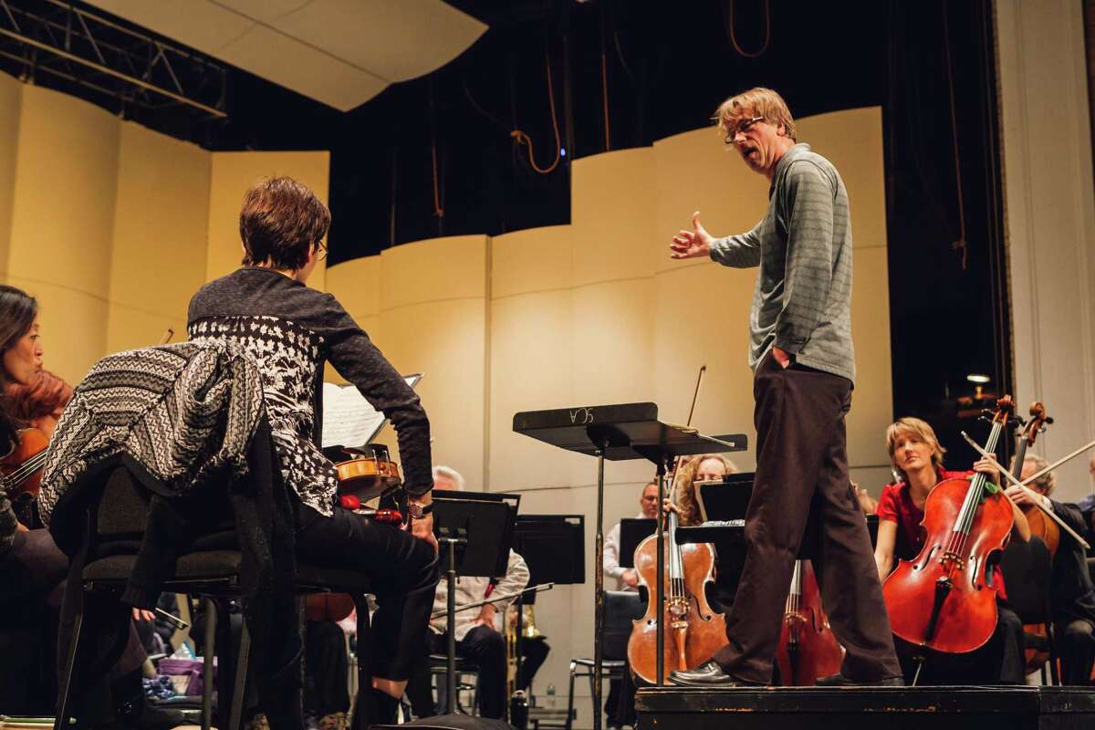 Eckart Preu conducting a recent rehearsal at the Palace Theater of Stamford.