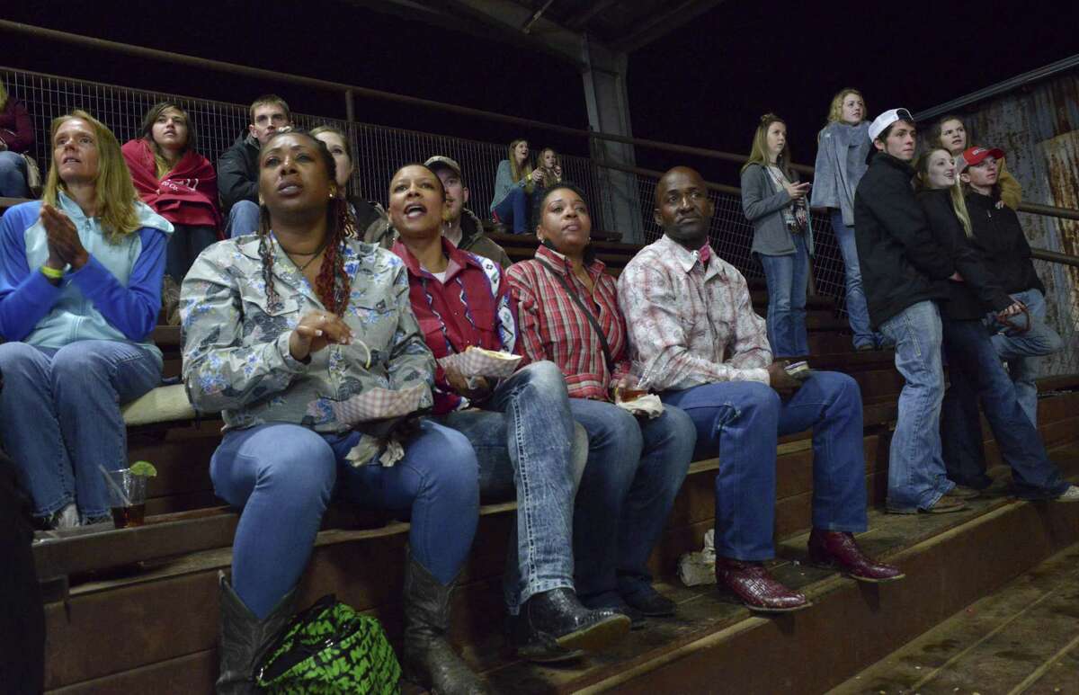 Rodeo fans watch the bull-riding event at Tejas Rodeo.