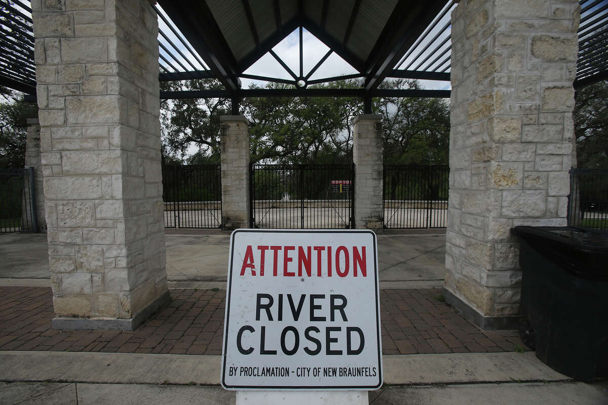 A sign at Prince Solms Park in New Braunfels lets visitors know that the Comal River is closed. Recent rainfall has caused the river level to rise.